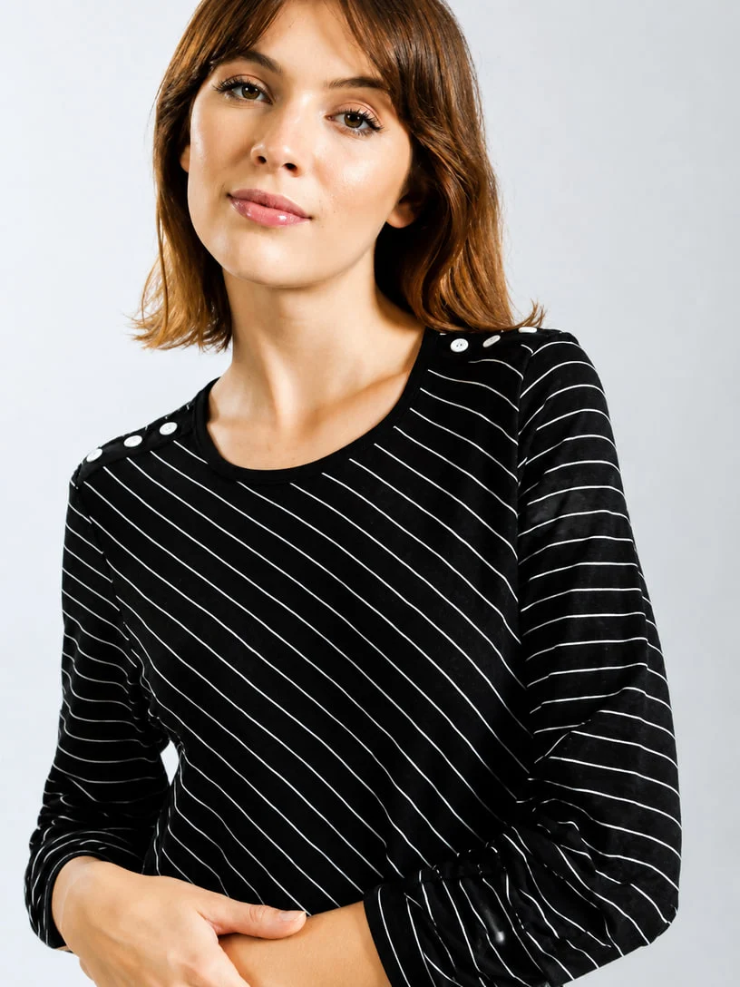Black striped knit top on a model