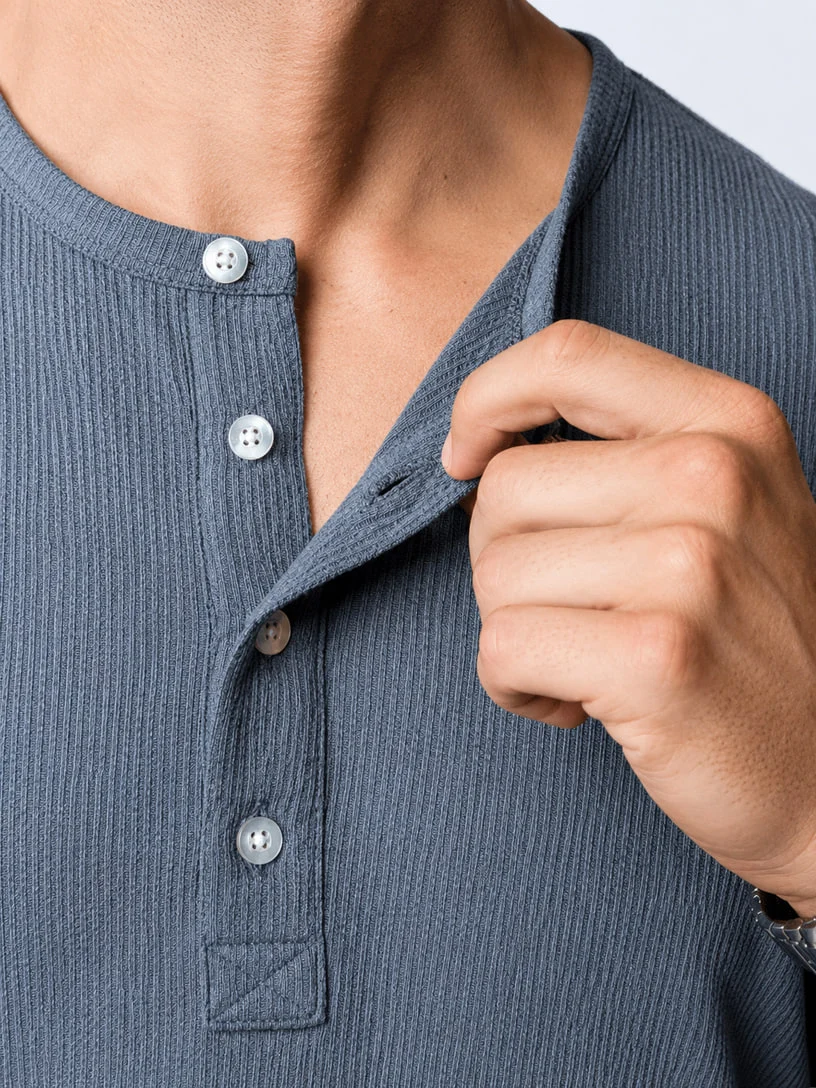 Close-up of a gray ribbed henley placket